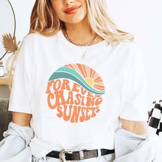 Forever Chasing Sunsets Shirt, Summer Shirt, Beach Tee, Sunset Shirt, Sunrise Shirt, Sunshine Shirt, Beachy Vibes Tee, Aesthetic Summer Tee This tee is the cutest shirt provide a fun and creative way to share the good news with friends and family, family photos and pictures. 👉HOW TO ORDER👈 1️⃣ Please review all the information provided before placing an order 2️⃣ Select the shirt type and size using the drop down menu. 3️⃣ Select the color of the shirt using the following drop down menu. 4️⃣ Need more Items? Add the current item in the cart. And If you like to add more items to your order please press the back button and repeat steps 1-3 again. 5️⃣ Once all your desired items are in your cart you may complete your order by entering your payment method, desired shipping address and click Retro Tops With Funny Print For Summer, Summer Graphic Tee Camp Shirt With Crew Neck, Summer Cotton Camp Shirt With Screen Print, Summer Crew Neck Shirt With Letter Print, White Shirt With Text Print For Summer, Retro Beach Tops With Letter Print, Summer White Camp Shirt With Letter Print, White Summer Camp Shirt With Letter Print, Summer Short Sleeve Slogan Shirt