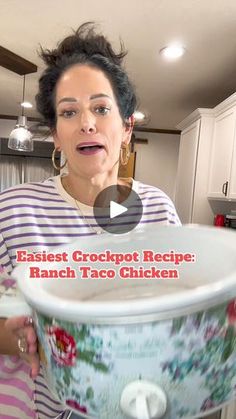 a woman is holding an empty crockpot in her kitchen with the words easy crockpot recipe ranch taco chicken