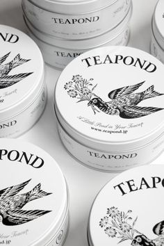 six teapond tins sitting next to each other