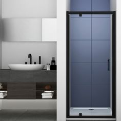 a bathroom with a glass shower door and sink