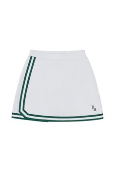 The Spelman skirt is a fresh tennis skirt silhouette, perfect for any club sport including pickle ball or golf. Designed as a wrap around A-line style with sporty trim details, the skirt also features undershorts. Machine wash cold with like colors. Tumble dry low to avoid shrinkage 75% Nylon, 25% Spandex RH-229-WHTGRN Tennis Skirts Casual, Sporty Lined Tennis Skirt, Sports Skirt, Golf Clothing, Sporty Fitted Tennis Skirt With Contrast Trim, Sporty Skirt, Affordable Retro Pleated Tennis Skirt, Luxury Relaxed Mini Tennis Skirt, Luxury Relaxed Fit Mini Tennis Skirt