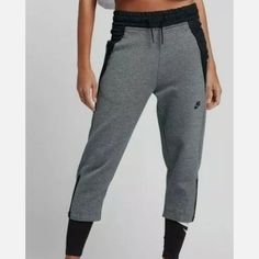 Nike Women's Sportswear Tech Fleece Crop Pants Black Gray Capri Size Xs $110 New Flat Lay Measurements: Waist: 14 " Length: 32 1/2 " Inseam: 20 1/2" Nike Gray Joggers For Gym, Nike Sporty Gray Joggers, Nike Gray Joggers For Sports, Gray Sporty Sweatpants For Workout, Casual Capris For Sports, Nike Gray Athleisure Joggers, Nike Sports Pants In Gray, Nike Gray Sports Pants, Nike Gray Sportswear Activewear