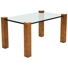 a glass and wood table with two legs on it's sides, against a white background