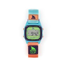 Dive into retro vibes with the Blue Melon, Freestyle Watches' freshest digital surf watch. Infused with muted neons inspired by the vibrant 80s and 90s, this timepiece brings a wave of nostalgia to your style. Make a bold statement where function effortlessly meets fashion, whether you're riding the waves of tides or trends. Blue Melon Shark Watch doesn't just look good; it's designed to seamlessly function in and out of the water, making it your ideal companion for catching waves with confidenc Shark Watch, Surf Watch, Freestyle Watch, Lifeguard Hat, Cloud Stickers, Shark Clip, Surf Suit, Shopping Event, Kids Watches