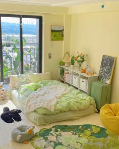 a bed room with a neatly made bed next to a window and a book shelf