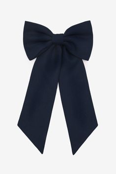 This large, schoolgirl-inspired bow is made of the same poly gabardine that we use to make our beloved tennis skirts. This textile offers a classic look with polished structure. Features a french barrette hair clasp.  Made in Los Angeles, Calif. Our experienced sewers earn up to $25 an hour and no less than $17.25; additionally workers have healthcare benefits for less than $15 per week, a 401k plan, paid sick days, subsidized bus passes and favorable overtime benefits.  • Made in Los Angeles, Calif.  100% Polyester Lace Knitwear, Denim Short Jumpsuit, Hair Clasp, Kids Garments, Wardrobe Solutions, 401k, Tennis Skirts, Long Sleeve Kids, French Barrette