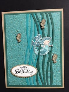 a happy birthday card with seahorses on the bottom and an ocean themed background