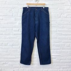 40x33 Vintage Men’s 1970s 1980s Big Mac Denim Painter Carpenter Pants Jeans For your consideration we have a pair of jeans from the ‘70s/‘80s. Made by Big Mac and done in blue denim with contrast orange stitching, these pants feature two hip pockets, watch pocket, belt loops, brass YKK zipper, two back pockets, hammer loop, and ruler pocket. These jeans seem to have seen little use in actual labor and have plenty of life left in them. Measurements;Waist- 20”Rise- 15”Thigh- 15”Inseam- 33”Leg Open Watch Pocket, Jean Vintage, Big Mac, Carpenter Pants, Vintage Pants, Ykk Zipper, Pocket Belt, Pants Jeans, Hat Sizes