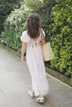 Style // A flirty and feminine blush look that is faded and subtle for the perfect pink linen dress The Soller Dress is a feminine, flirty and fun dress for any occasion. A midi to long dress with a tiered skirt, the square neckline and puffed sleeves make it a dreamy addition to any wardrobe. It features and elastic bodice and tie detailing on the back to ensure the best possible fit. The dress has some structure while leaving plenty of room for comfort and ease, for an effortless approach to d Elegant Summer Puff Sleeve Dress With Tie Back, Spring Square Neck Puff Sleeve Dress With Tie Back, Feminine Tiered Puff Sleeve Dress For Garden Party, Feminine Puff Sleeve Dress With Square Neck For Brunch, Pink Midi Dress With Tie Back For Brunch, Feminine Midi Dress With Tie Back, Feminine Midi Dress With Tie Back And Square Neck, Feminine Square Neck Midi Dress With Tie Back, Feminine Puff Sleeve Dress With Ruffle Hem For Spring