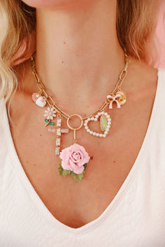 Add some charm to your outfit with THE KATE CHARM NECKLACE! This gold chain necklace is adorned with a playful array of pink flowers, pearl hearts, jeweled crosses, seashells, pink ribbons, a gold cowboy hat, and more. Perfect for any quirky and fun fashionista! Gold Cowboy Hat, Garden Party Outfit, Bride Accessories, Usa Dresses, Gold Chain Necklace, Cowboy Hat, Pink Ribbon, Gold Chain, Gold Chains