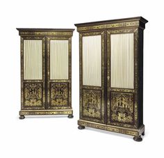 an ornately decorated armoire stands next to a smaller armoire with curtains on it