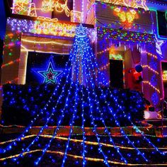 a house covered in christmas lights and decorations