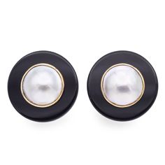 pair of black and gold earrings with white pearls on the front, one in round shape