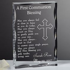 an acrylic plaque with a cross on it and the words, a first communion blessing