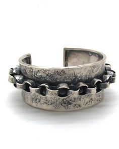 Silver Bracelet - Sculptural yet earthy with a rich oxidized finish, this hand-forged sterling silver cuff is embellished with a handcrafted stationary chain for dramatic flourish.  <br><br>Clean with warm water and soap, or lightly rub with a polishing cloth.  <br><br>Please specify size below: <br> S: 2.25dia  <br>M: 2.5dia  <br>L: 2.63dia Silver Y Necklace, Ring Chain, Semi Precious Jewelry, Artful Home, Beaded Bracelet Patterns, Knot Earrings, Beaded Bracelets Diy, Old Jewelry, Sterling Silver Cuff