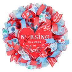 a wreath made out of hearts with the words nursing is a work of heart on it