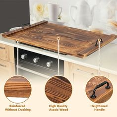 the wooden cutting board is attached to the counter top with three different handles and features