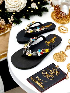 Description The beautiful rhinestone and customizable Flip Flops for the beach brides, bridesmaids, vacation, honeymoon or any occasion you desire to look gorgeous. Perfect in any outfit! Being unique and stunning on design, these flip flops must be your must-have item! The sandal is anti-slip, comfortable and durable as it is made from high quality rubber from the South of Thailand, where is famous for the best rubber tree. Moreover, the crystals are decorated on the sandal with effective adhes Black Rhinestone Flip Flops For Beach, Bling Flip Flops, Beach Wedding Sandals, Bling Design, Being Unique, Walk On The Beach, Rubber Tree, Beach Bride, Sandals Beach