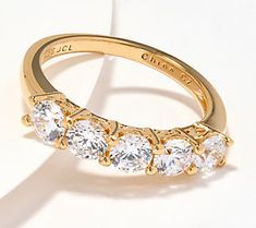 If rings are amongst your favorite things, you're gonna love this beautiful band that brandishes five sparklers. Let it be a symbol of celebration for a milestone or memory in your life. Or add it to your jewelry collection .... just because! Glamorous Gold Diamond Ring For Anniversary, Classic Sparkling Rings For Anniversary, Glamorous Yellow Gold Jewelry For Anniversary, Glamorous Round Diamond Ring For Anniversary, Adjustable Sparkling Diamond Ring For Anniversary, Classic Sparkling Diamond Ring As Gift, Glamorous Anniversary Rings With Prong Setting, Fine Jewelry Sparkling Stackable Rings As Gift, Glamorous Round Rings For Anniversary