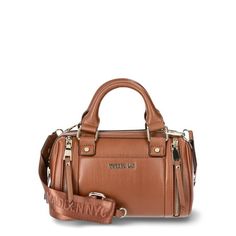 This Madden NYC Women's Multi Zipper Barrel Bag in Cognac is the perfect addition to your Fall wardrobe! This bag is 100% polyurethane and has a zipper closure for the main compartment. The interior features a zipper pocket on the back wall. The exterior has slip pocket on the front wall with a double zippered detail on both sides. There is a also a small zipper pouch that can be removed from the crossbody strap. The crossbody strap has Madden NYC logo embroidered detailing and clips on both sides to be completely removed if you prefer to carry the bag by the double top handles. This is a classic bag that you'll not only want use all Fall, but all year 'round! Size: one size.  Color: Brown.  Gender: female.  Age Group: adult. Brown Canvas Satchel With Zipper Closure, Chic Brown Satchel With Zipper Closure, Brown Crossbody Satchel With Zipper Closure, Trendy Brown Satchel With Zipper Closure, Cognac Rectangular Satchel With Zipper Closure, Cognac Satchel Bag With Zipper Closure, Cognac Satchel With Zipper Closure For Daily Use, Rectangular Cognac Satchel With Zipper Closure, Brown Leather Bag With Metal Zipper