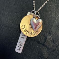 "New grandma personalized gift. Show your grandparent pride with this \"established\" grandma necklace. 1 1/4\" handstamped silver tag in script font \"est.\" with date you became (or will become) a grandma. Has a brushed satin, hammered finish. Charm is silver alkeme', which is a metal alloy that won't tarnish and is very durable. It is hypo-allergenic and nickel free and made in the USA. 5/8\" brass disc stamped \"grandma\" or any name you prefer... nana, mama, granny, etc. 1/4\" silver heart Grandma Jewelry, New Grandma Gift, Grandma To Be, Grandmother Necklace, Grandma Necklace, Personalized Grandma Gifts, New Grandma, Personalized Grandma, Grandma Gift