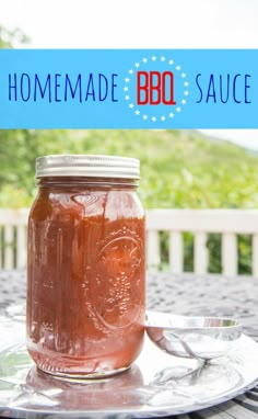 a jar of homemade bbq sauce sitting on top of a table