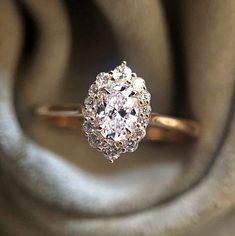 Oval Cubic Zirconia Wedding Ring, Oval Cubic Zirconia Diamond Ring For Wedding, Oval Diamond Cut Wedding Ring, Dazzling White Cluster Ring With Halo Design, Dazzling Halo Design Wedding Jewelry, Oval Wedding Ring With Prong Setting, Dazzling Halo Setting Wedding Ring, Dazzling Wedding Ring With Halo Setting, Oval Diamond White Wedding Rings