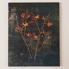 a painting with orange flowers on a black background