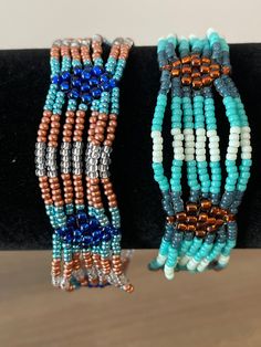 These are hand sewn multi-strand bracelets. The are both 7 1/2 inches long. Multi Strand Bracelet, Strand Bracelet, Multi Strand, Hand Sewn, Hand Sewing, Jewelry Bracelets, Beaded Bracelets, United States, Ships