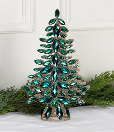 a christmas tree made out of green crystal stones