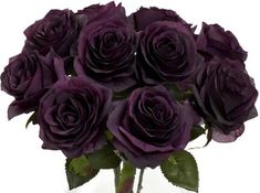 a bunch of purple roses in a glass vase