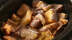 powdered sugar on top of bread in a crock pot