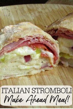 a close up of a sandwich cut in half on a cutting board with the words italian stromboli make ahead