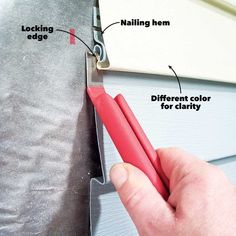 a hand holding a pair of red scissors near a window frame with the words locking edge, nailing hem and different color for clarity