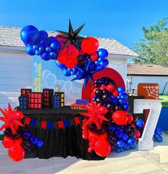 a table with balloons and decorations on it