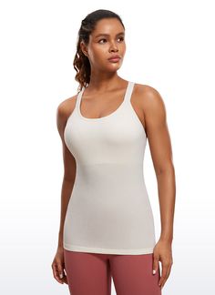 Seamless collection of smooth, breathable fabric is designed to help reduce chafing, encourage ventilation and wick away sweat to help you stay dry. Y-back and scoop neck gives you a stylish look. Built in shelf bra with removable pads provides extra support. Feature & Fitting: 
 Seamless collection 
 Design for yoga 
 Y-back 
 Built in bra & removable pads 
 Fabric: 
 Chafe-free, seamless construction 
 Sweat-wicking, soft ribbed textured fabric 
 Lightweight and stretchy 
 Body: 100% P Otaru, Shelf Bra, Hip Length, Breathable Fabric, Scoop Neck, Spandex, Yoga, Couture, Tank Tops