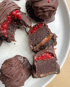 there are chocolates with raspberries on the plate