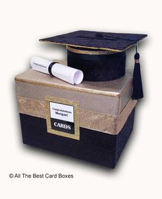 a graduation cap and diploma laying on top of each other with the caption card boxes