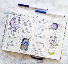 an open notebook with drawings on it