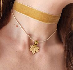 Beige velvet ribbon choker with handmade maple leaf. Material of leaf is polymer clay with using gold leaf. Length of necklace is adjustable:  10-12 inches/ 25,4 - 30,5 cm 11-13 inches/ 28-33 cm 12-14 inches/ 30.5- 35.5 cm 13-15 inches/ 33-38 cm 14-16 inches/ 35.5 cm-40.5 cm 15-17 inches/ 38,1 cm- 43,2 cm 16-18 inches/ 40.6 cm- 45.7 cm 17-19 inches/ 43 cm - 48 cm 18-20 inches/ 45,5- 50.8 cm Width of ribbon 15 mm / 0.6 inches If you need other length of necklace let me know and I will make it for you. Polymer clay isn't afraid of water, strong and non-toxic. Gorgeous gift for women and girls as handmade item ALL CHOKERS - https://www.etsy.com/shop/BuduartJewelry?ref=simple-shop-header-name&listing_id=694544029§ion_id=22629985 DROP EARRINGS WITH BLUE SPARKLY ROSES- https://www.etsy.com/listi Gold Choker With Adjustable Length As Gift, Handmade Jewelry For Fall, Elegant Fall Jewelry Gift, Elegant Fall Jewelry For Gifts, Beige Jewelry With Adjustable Length For Gift, Beige Adjustable Length Jewelry For Gift, Handmade Adjustable Jewelry For Fall, Handmade Jewelry For Fall Gift, Adjustable Handmade Jewelry For Fall