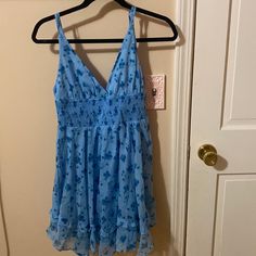 Never Worn, Brand New With Tags. Fits So Nicely, And Is Very Flattering. The Floral Pattern Is So Cute. Can Be Dressed Up Or Down. The Elastic Waist Makes Everyone Look Amazing. Blue V-neck Sundress For Spring, Blue V-neck Lined Sundress, Blue Lined Sundress Mini Dress, Blue Lined Sundress, Blue Lined Mini Dress With V-neck, Blue Lined Summer Dress, Blue V-neck Lined Mini Dress, Blue Lined Mini Sundress, Blue Floral Print V-neck Sundress