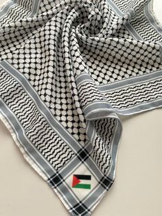 The fabric is of high quality and can be used as a fashion accessory. * The most traditional black and white scarf in Palestine * Palestine flag embroidered on corners Black And White Scarf, White Scarf, Hooded Scarf, Scarf Wrap, Scarf Accessory, Accessory Gift, Pet Supplies, Display Homes, Fashion Accessories