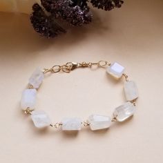 You're a real gem and your jewelry should be too! Make a unique statement in our new chunky Moonstone bracelet. Gorgeous chunks of glowing natural rainbow moonstone create an elegant and mesmerizing piece of jewelry you'll cherish for years to come. Each piece of Moonstone is 100% natural and one of a kind. Your choice of either Gold Filled (shown) or Sterling Silver wire and components. Each bracelet is made to order in your choice of size. Sizing: Small-Medium fits 6 1/2 to 7 inch wrist Medium Moonstone Bracelets With Natural Stones For Healing, Healing Moonstone Bracelet With Natural Stones, Everyday Moonstone Bracelets With Gemstone Beads, Moonstone Gemstone Beaded Bracelet As Gift, Everyday Moonstone Gemstone Beads Bracelets, Spiritual Moonstone Bracelet Jewelry, Spiritual Moonstone Bracelet, Moonstone Bracelets With Natural Stones As Gift, Everyday Gemstone Bracelet With Moonstone