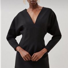 The Fabric Is A Heavy Crpe. It Has A Very Nice Weight To It And A Little Bit Of Stretch. I Purchased The Size Us 8 And The Size Us 10 The 8 Fit Me Beautifully. Black Spring Dresses With Structured Shoulders, Spring Black Dresses With Structured Shoulders, Black Dresses With Structured Shoulders For Spring, Black Dress With Structured Shoulders For Fall, Fall Date Night Dress With Structured Shoulders, Structured Mini Dress For Evening In Fall, Structured Mini Dress For Fall Evening, Structured Fall Dresses For Cocktail, Black Structured Fall Dress