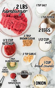 the ingredients to make hamburger patties on a marble counter top