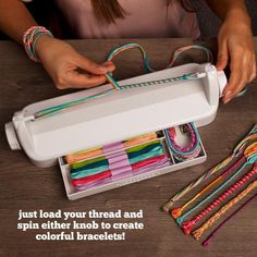 a woman is making colorful bracelets out of paper and plastic tubes with the words just load your thread and spin either knot to create colorful bracelets