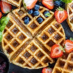 waffles with syrup and strawberries on the side