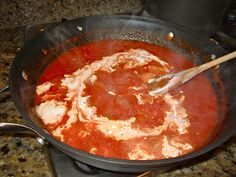 a pan filled with food on top of a stove