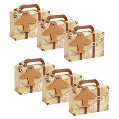 four pieces of luggage with wooden animals on them