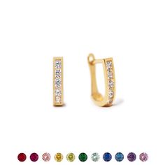 These 14K Gold huggies feature tiny colored gemstones. Great Birthstone gift! 14K Gold Colored crystal stones Hypoallergenic. Lead and nickel free Thickness 2mm Inside diameter 7mm Click lock closure #ES150-G Dainty Birthstone Huggie Earrings, Elegant Hoop Huggie Earrings With Birthstone, May Birthstone Huggie Earrings, Gold Huggie Earrings With Birthstone, 14k Gold Huggie Birthstone Earrings, Gold Huggies, Birthstones By Month, Colored Gemstones, Gold Stud Earrings